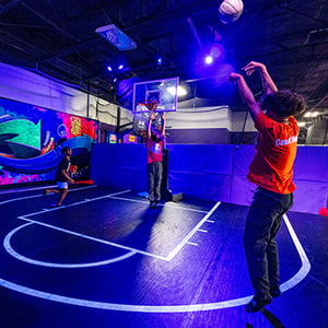 Multi-sports glow in the dark court at family adventure park